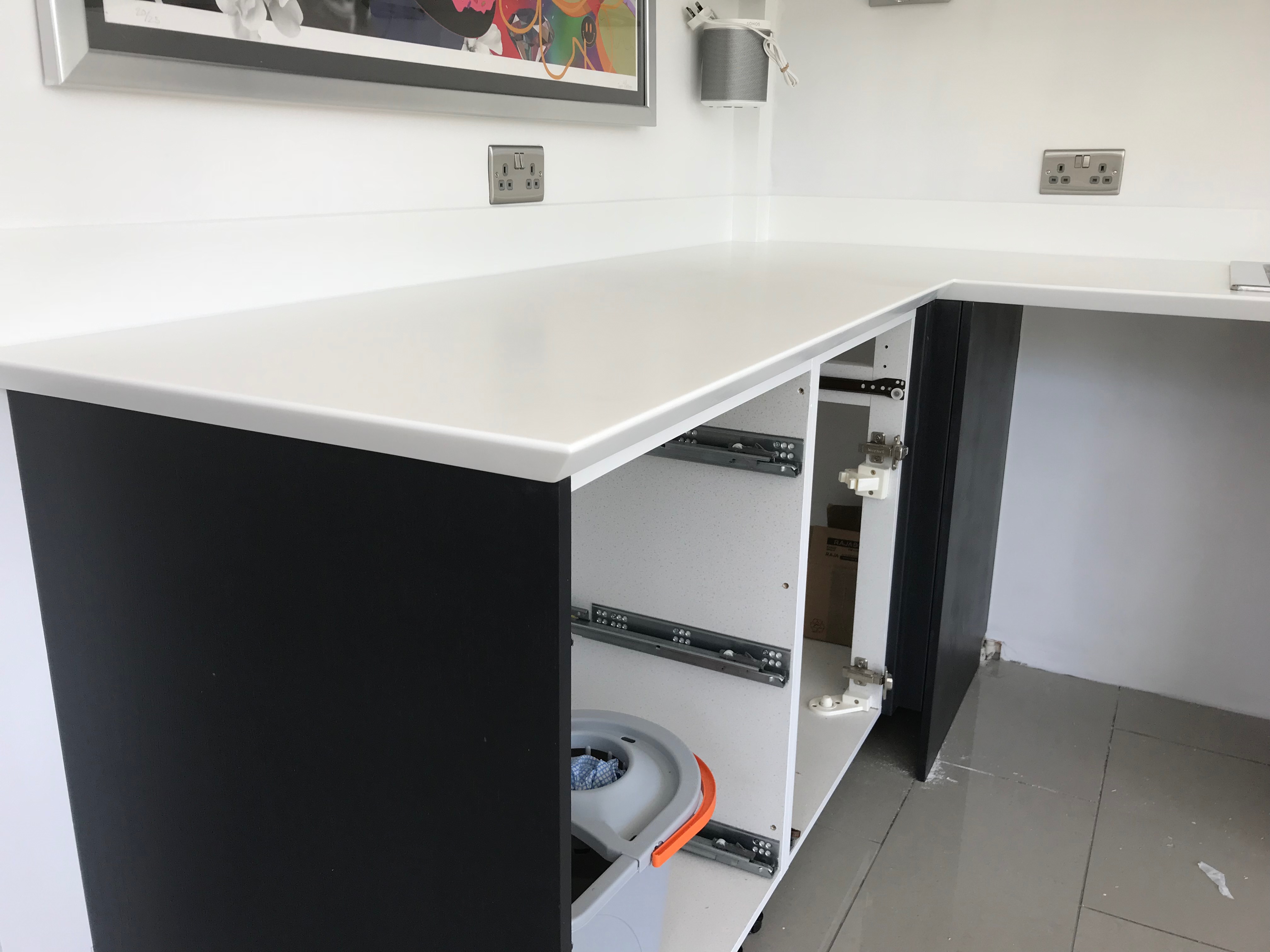 Staron Bright White Worktop with Dark Cabinets